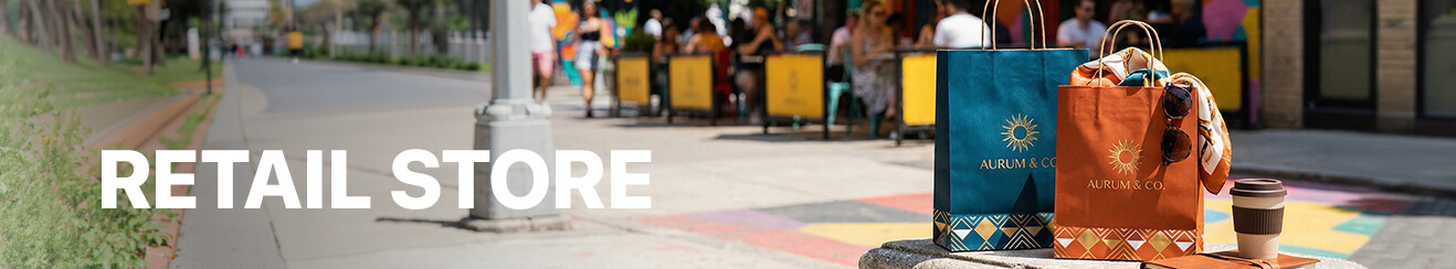 <br />
Retail store banner with "RETAIL STORE" text, featuring a black and a white branded shopping bag on a counter.